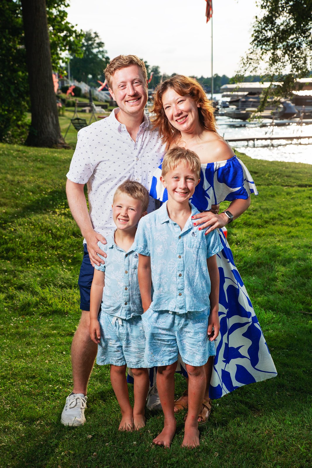 Family of four with two young boys by the waterfront